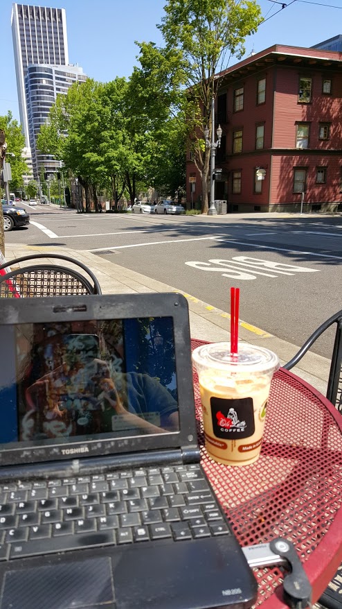 Enjoying the sun and a coffee from my favorite cart for lunch on Friday.